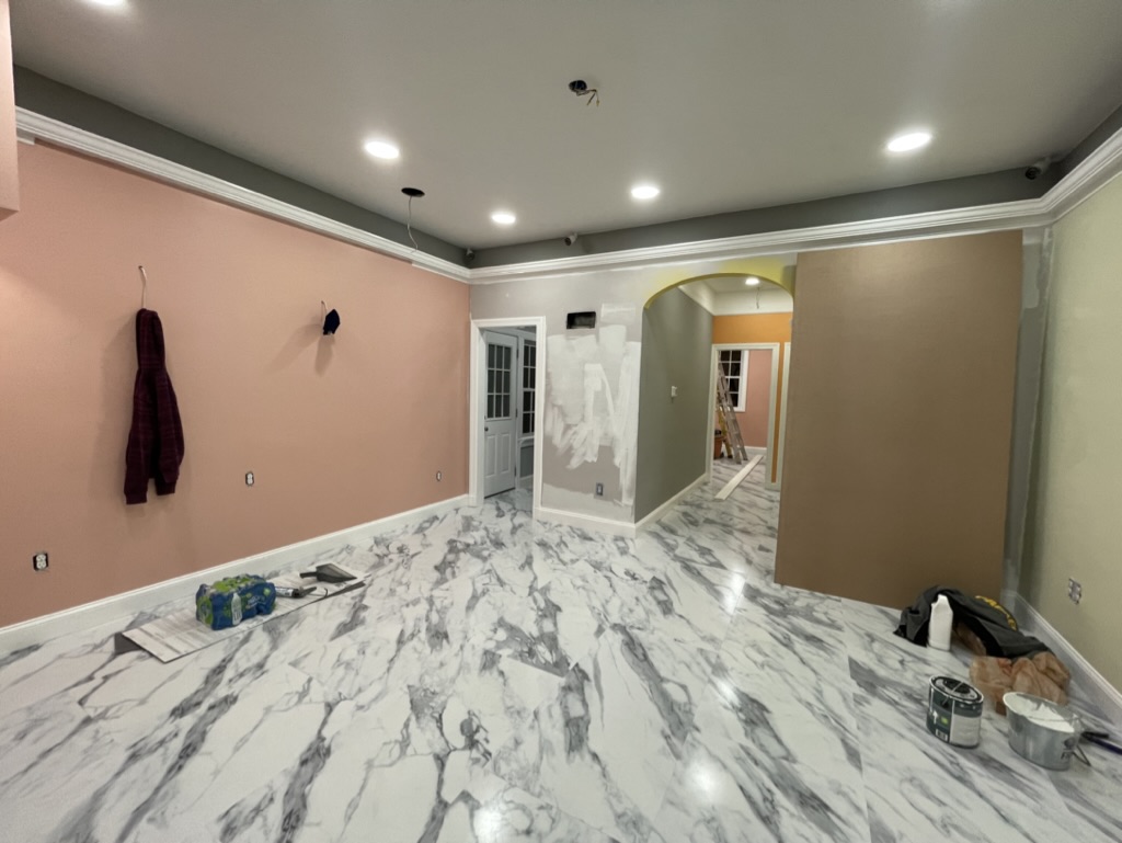 New flooring, recessed lighting, and interior painting in progress