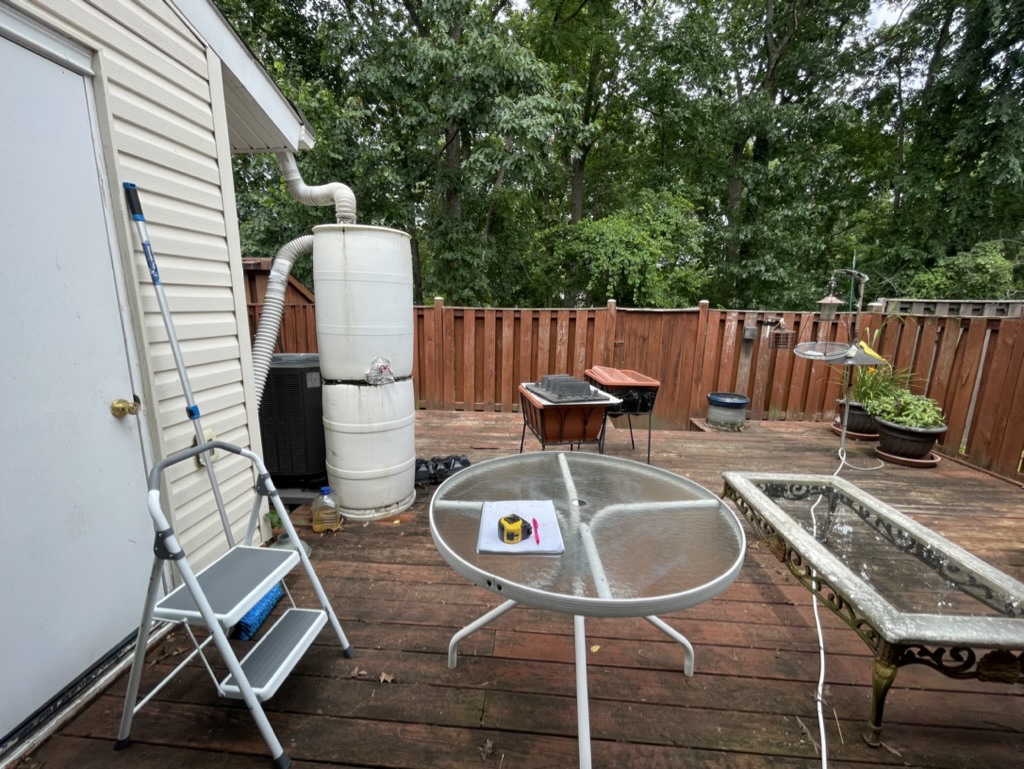 Original weathered pressure-treated backyard deck before renovation