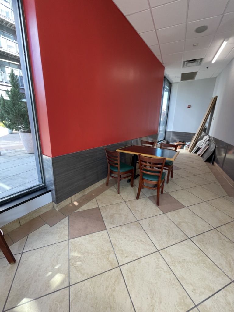 Finished dining-area wall with new paint and decorative lower wall panels