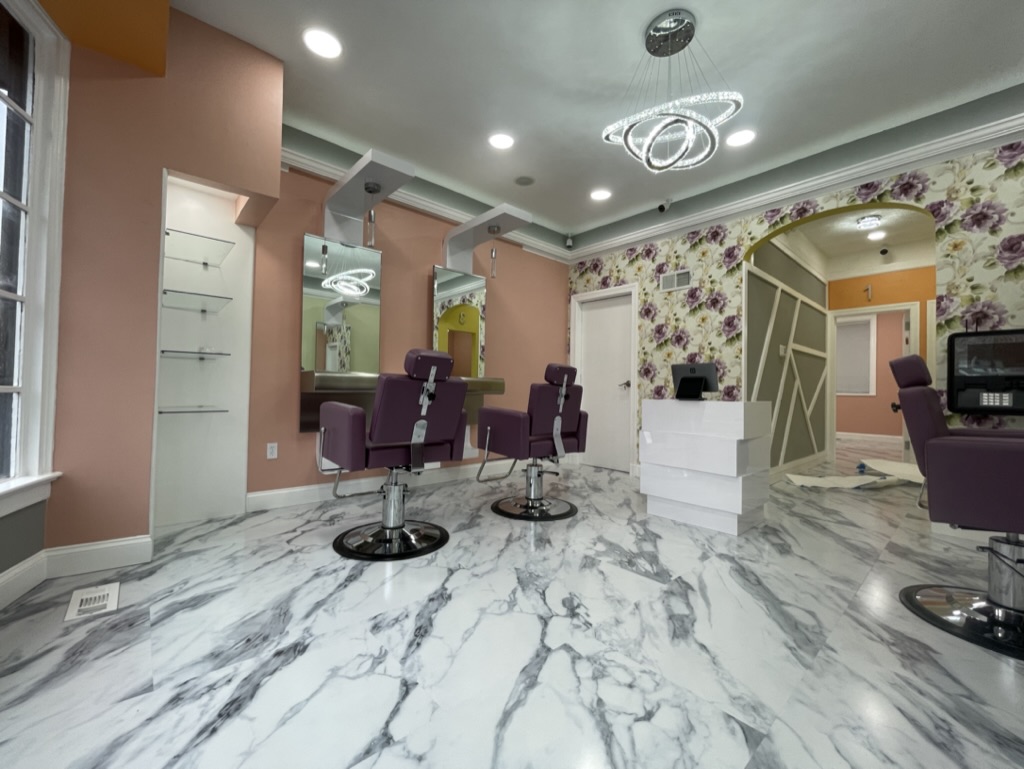 Finished main beauty service area with styling stations and reception