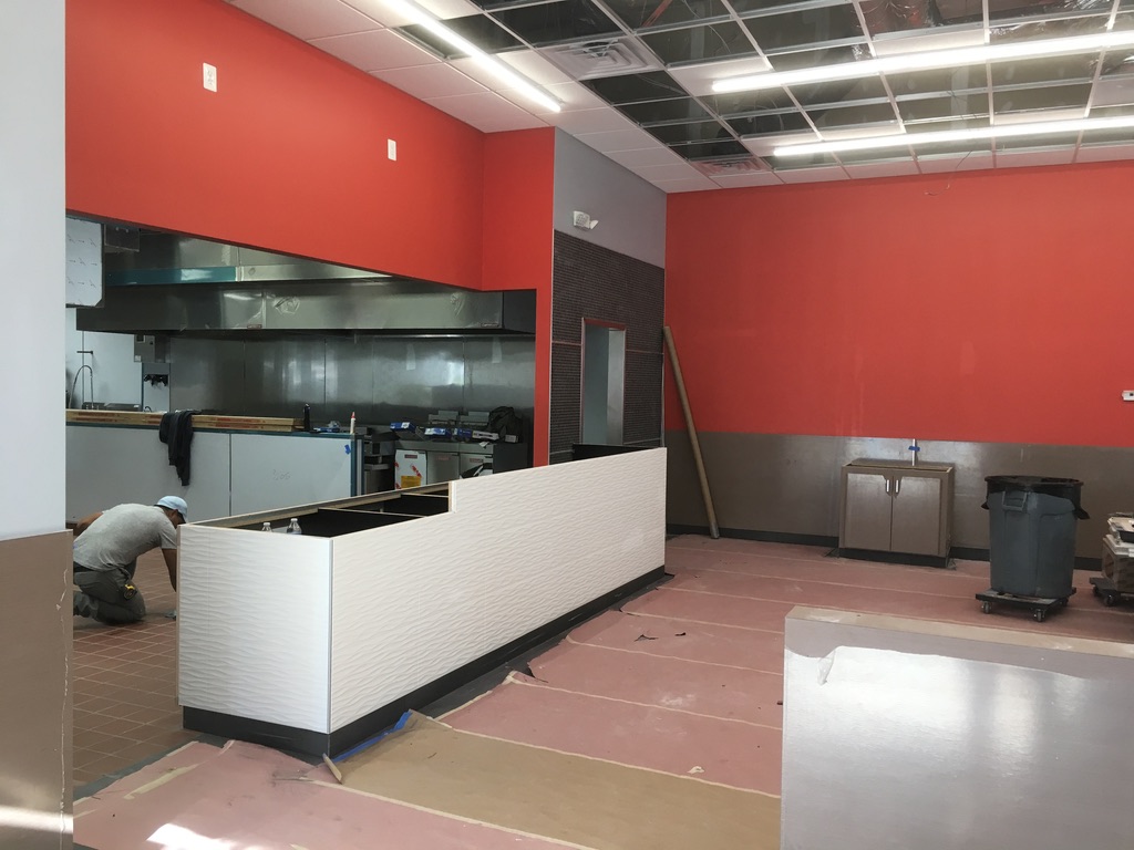 Service counter construction with new wall finishes and painting