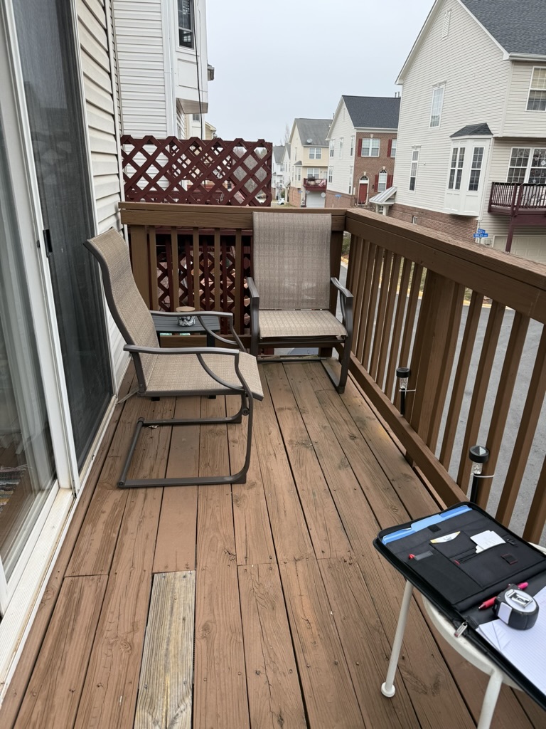 Original worn wood deck surface before composite replacement
