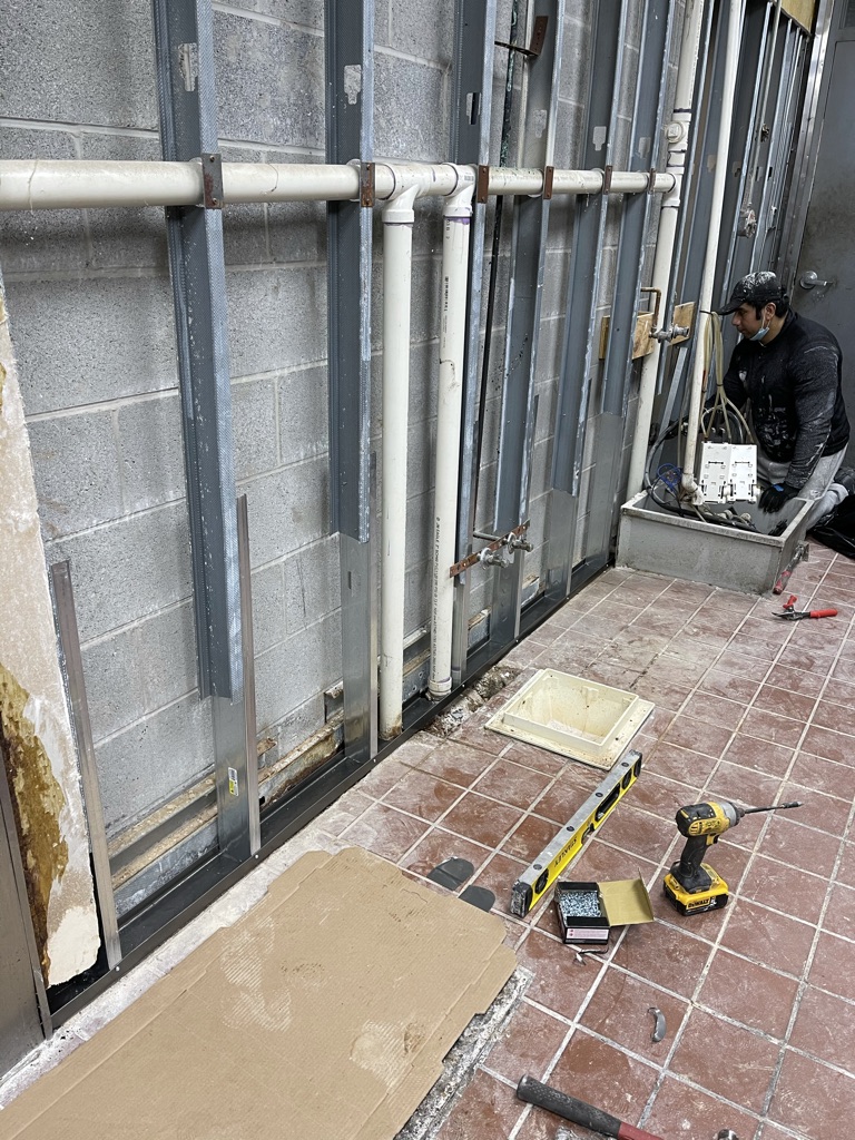Repair in progress – new metal stud framing and wall restoration
