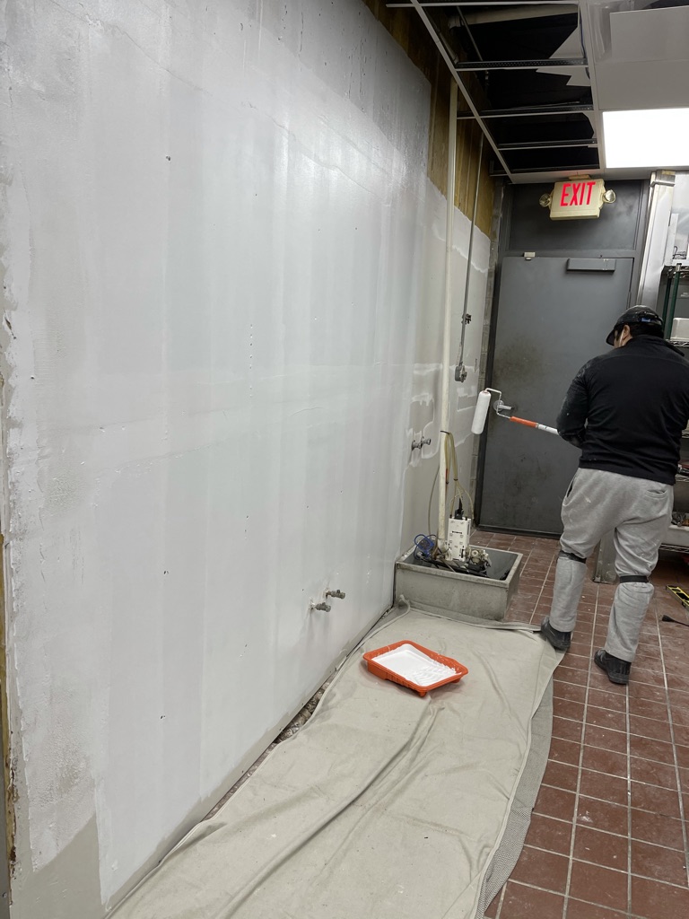 Drywall phase – repaired wall closed and primed