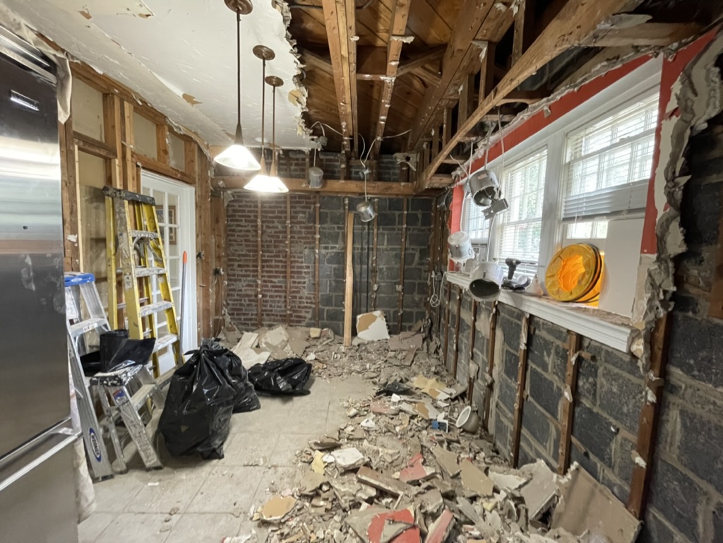 Full kitchen demolition — framing, ceiling, and walls opened up