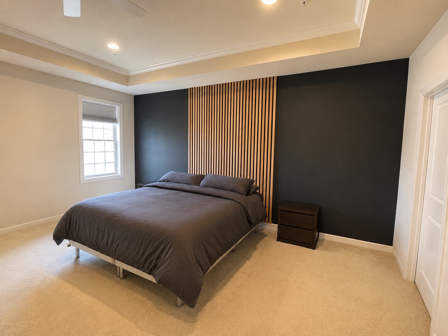 Completed custom accent wall with natural white oak wood slats