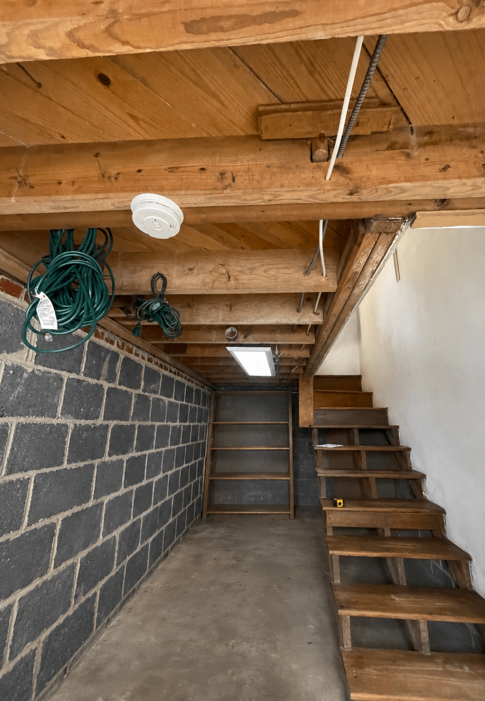 Existing unfinished basement before construction
