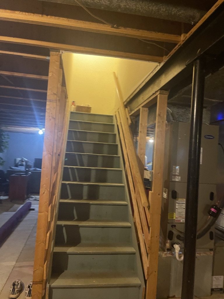 Existing stair and utility area prior to construction