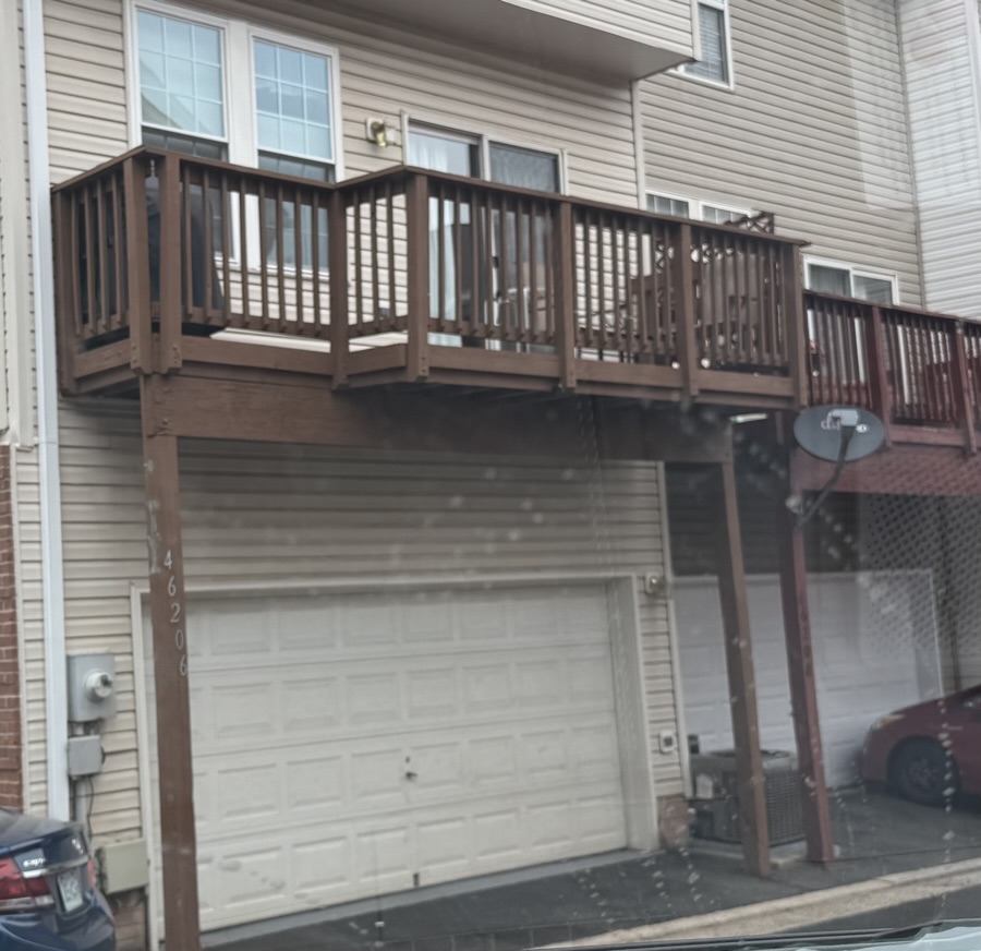 Existing wood deck — exterior view before construction
