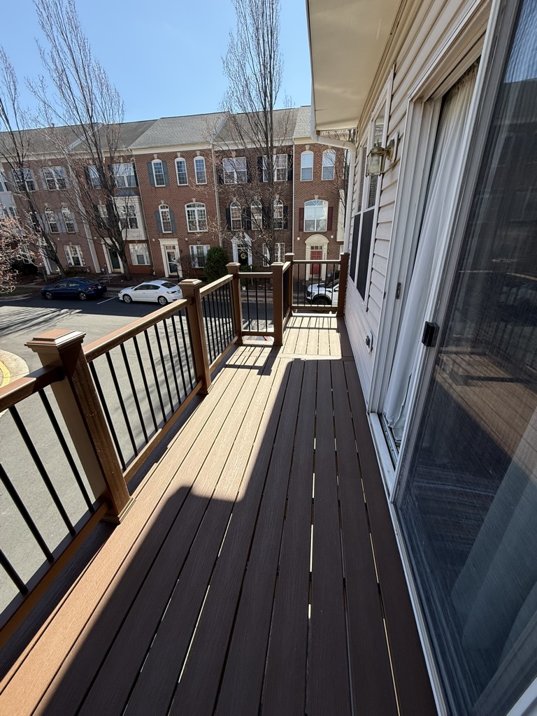 Completed composite deck with matching composite railing system