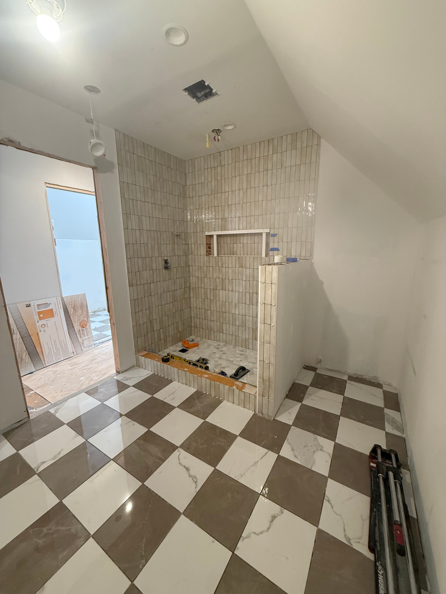 Custom tiled shower and floor nearing completion