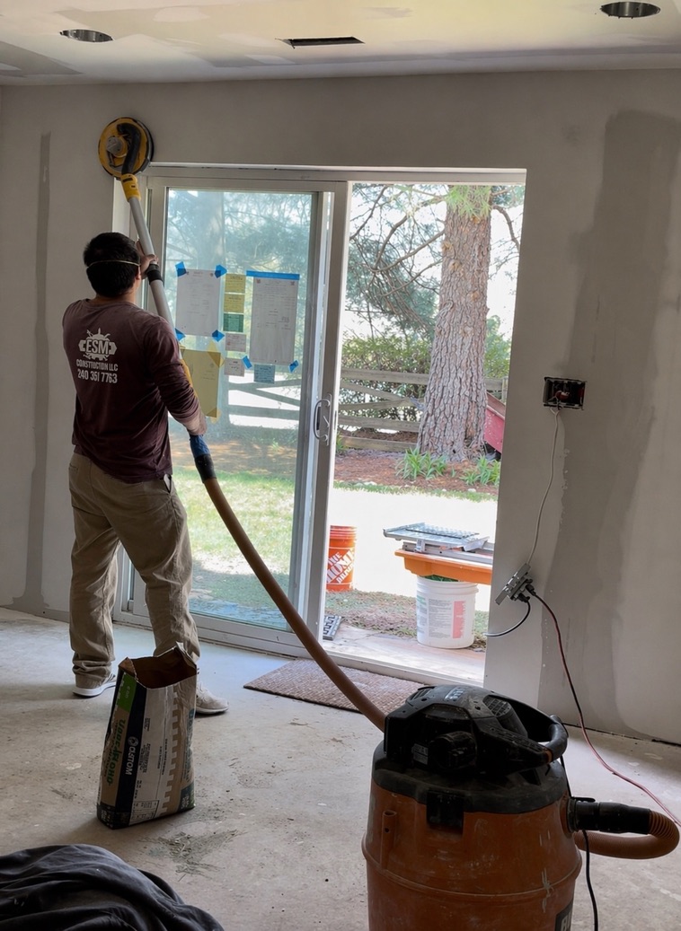 Drywall finishing and sanding by the ESM Construction team