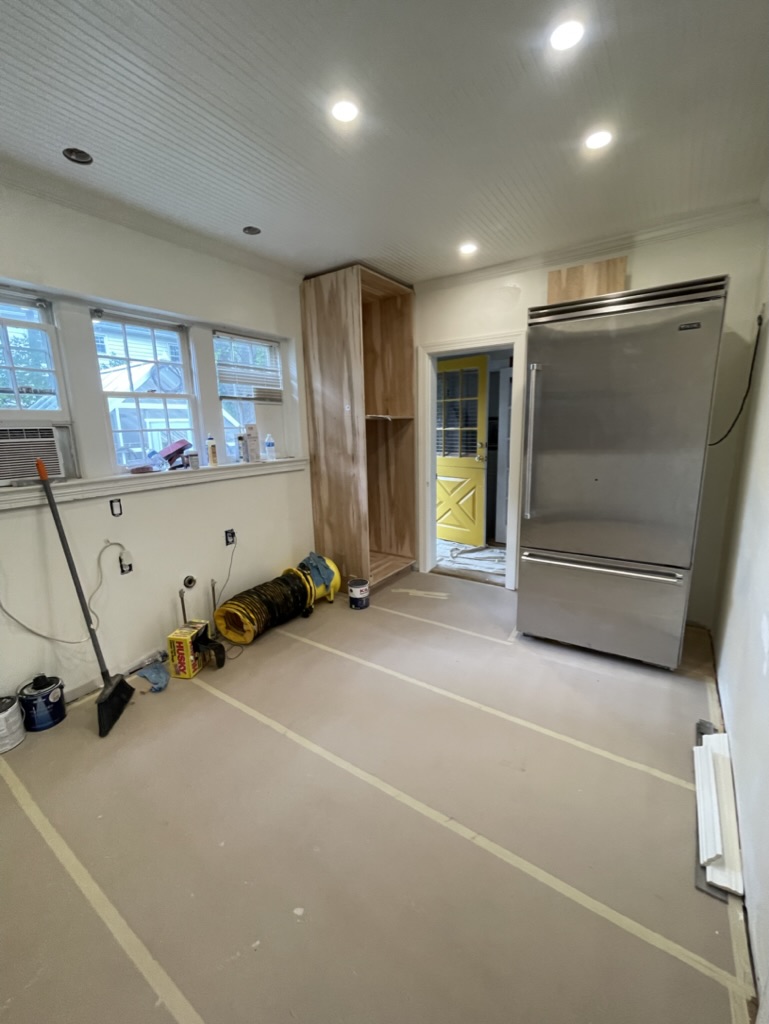 Construction phase — electrical, plumbing, drywall, beadboard ceiling, and recessed lighting installed