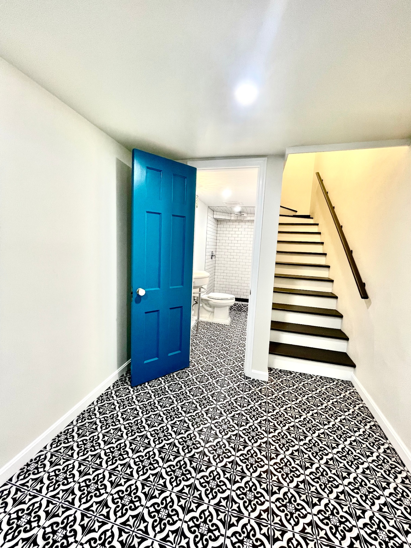 Finished hallway with new staircase and railing