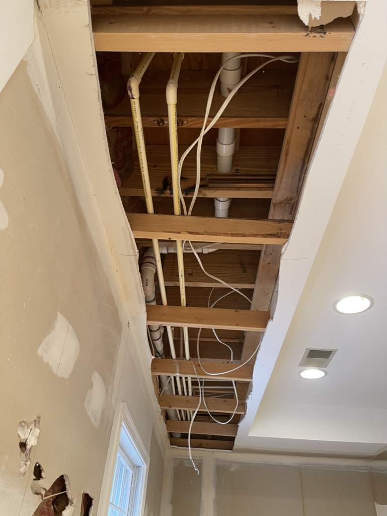 Bulkheads opened up to relocate plumbing and electrical lines for a clean, flat ceiling
